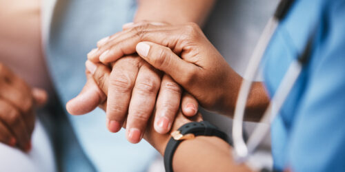 Empathy, trust and nurse holding hands with patient for help, consulting support and healthcare advice. Kindness, counseling and medical therapy in nursing home for hope, consultation and psychology.