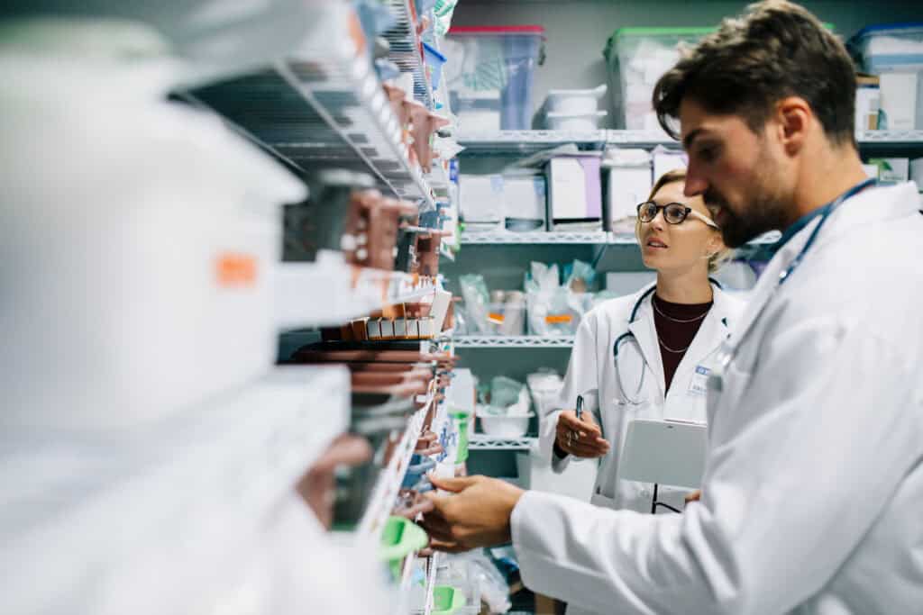 Two pharmacist working in drugstore.