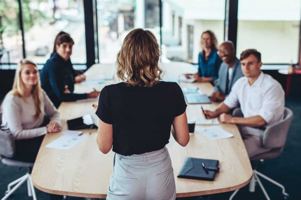 businesswoman addressing a meeting in office. Female manager having a meeting with her team in office boardroom.