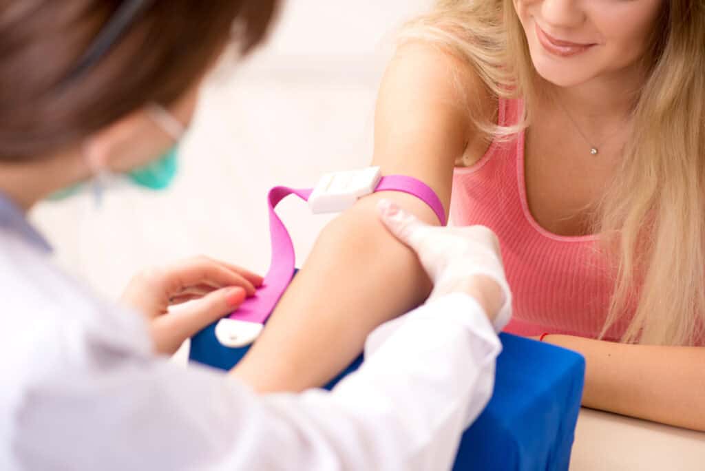 woman during blood test sampling procedure